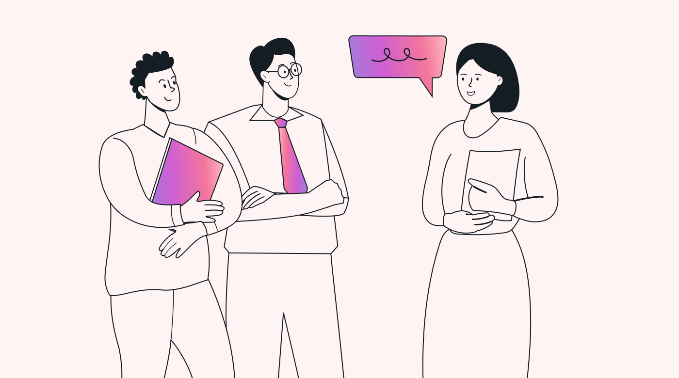 Two people listen to someone else talking