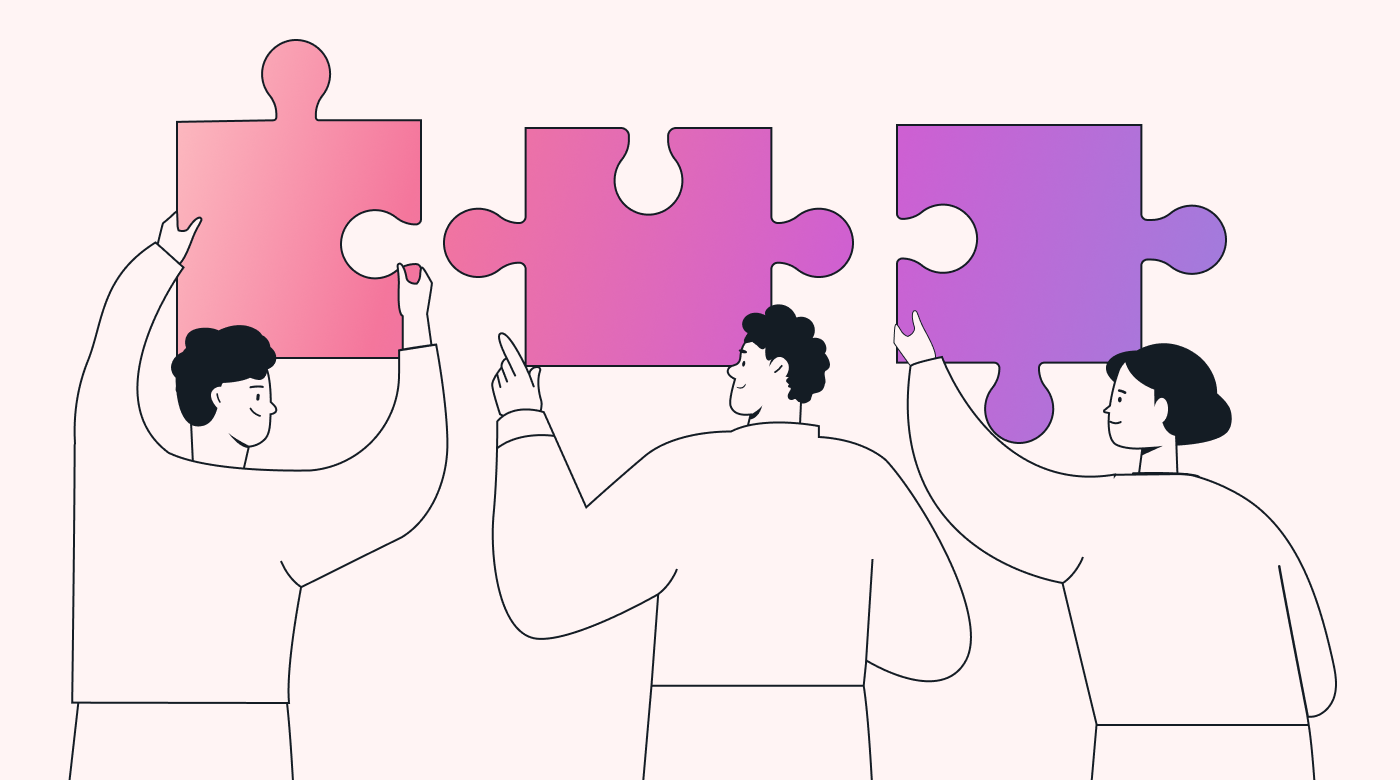 A team holding giant jigsaw puzzle pieces together