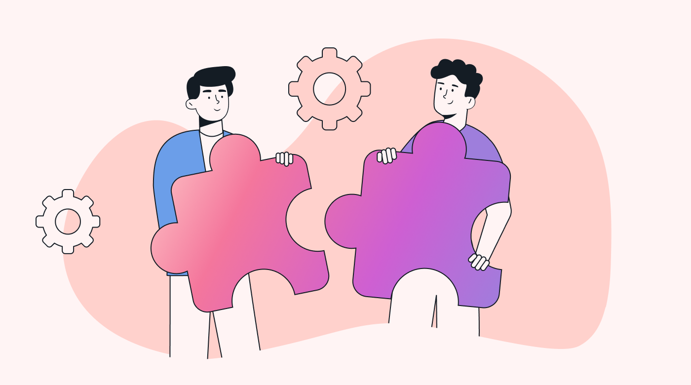 Two staff members collaborating on a task
