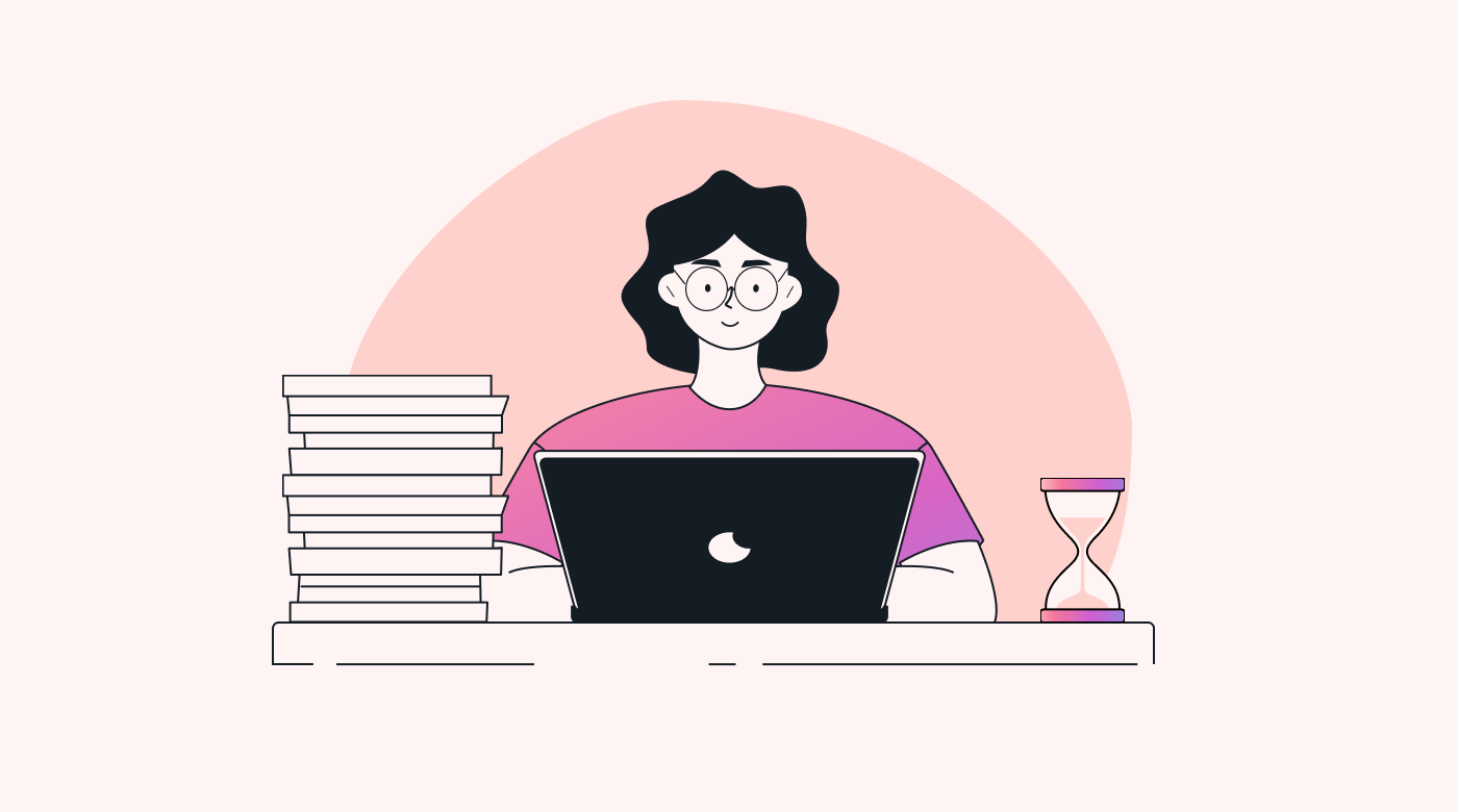 A person sitting at a desk with a clock, several piles of paper and a laptop in front of him/her.