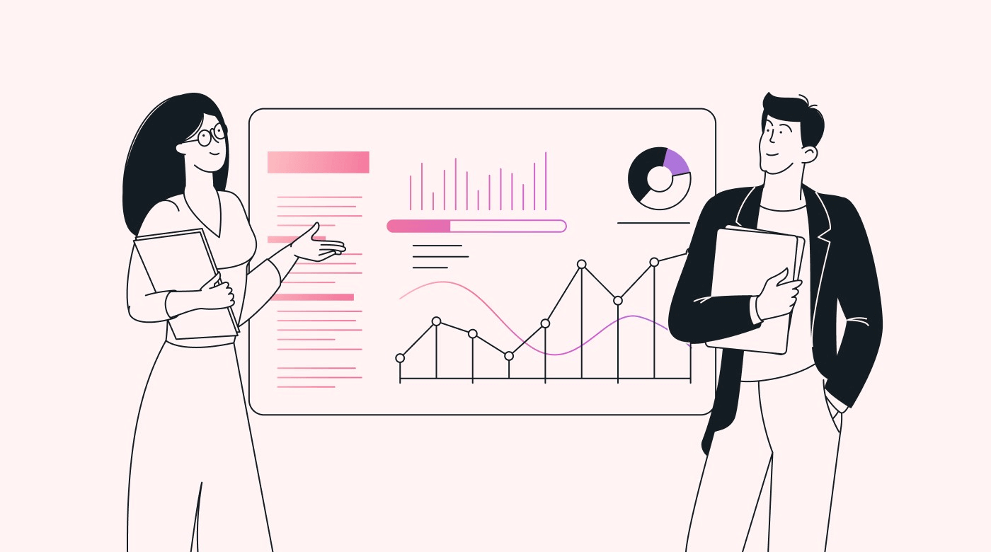 Two staff members discussing a board of charts