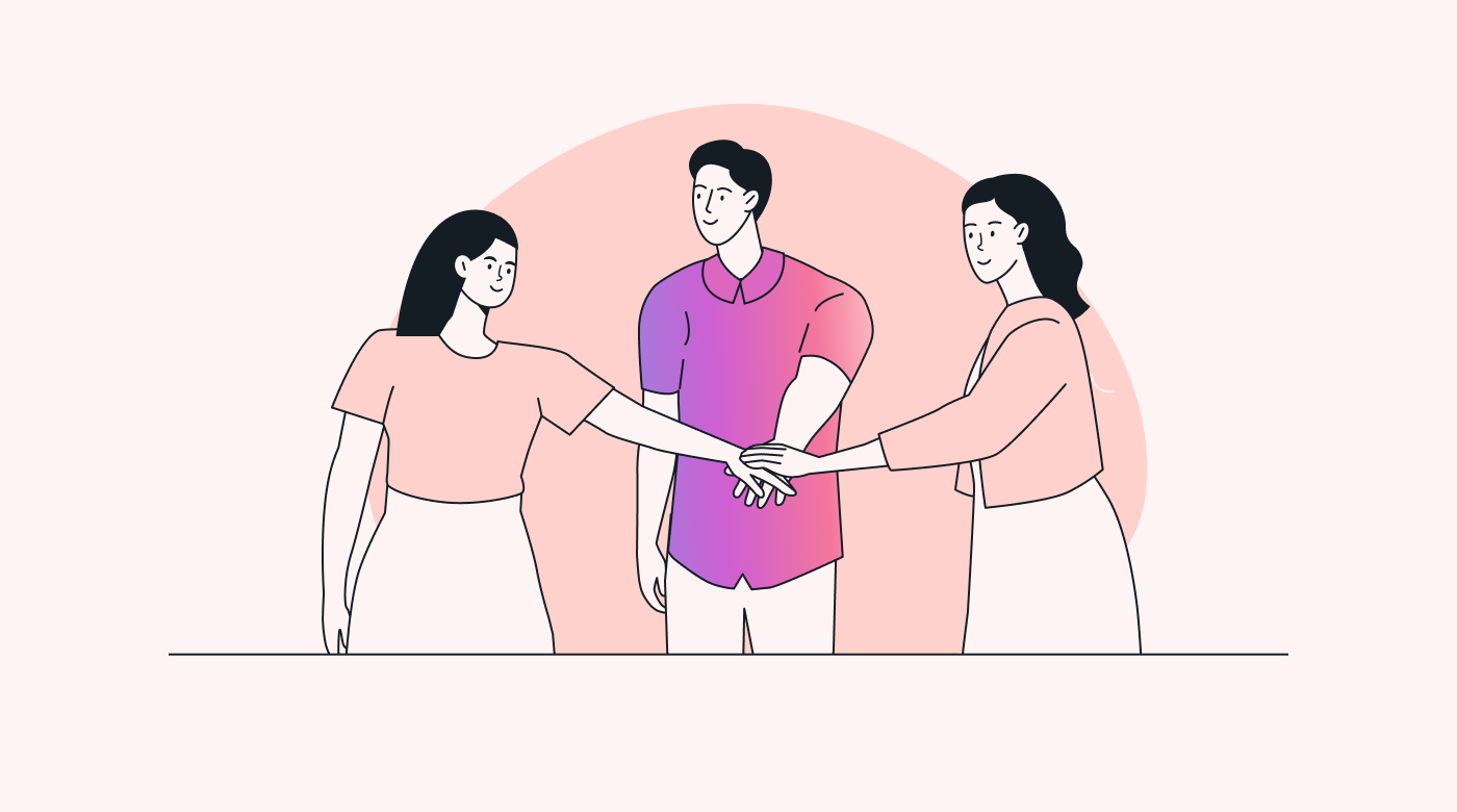 A team putting their hands together